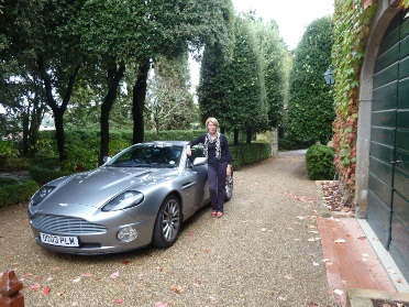 Aston parked next to House